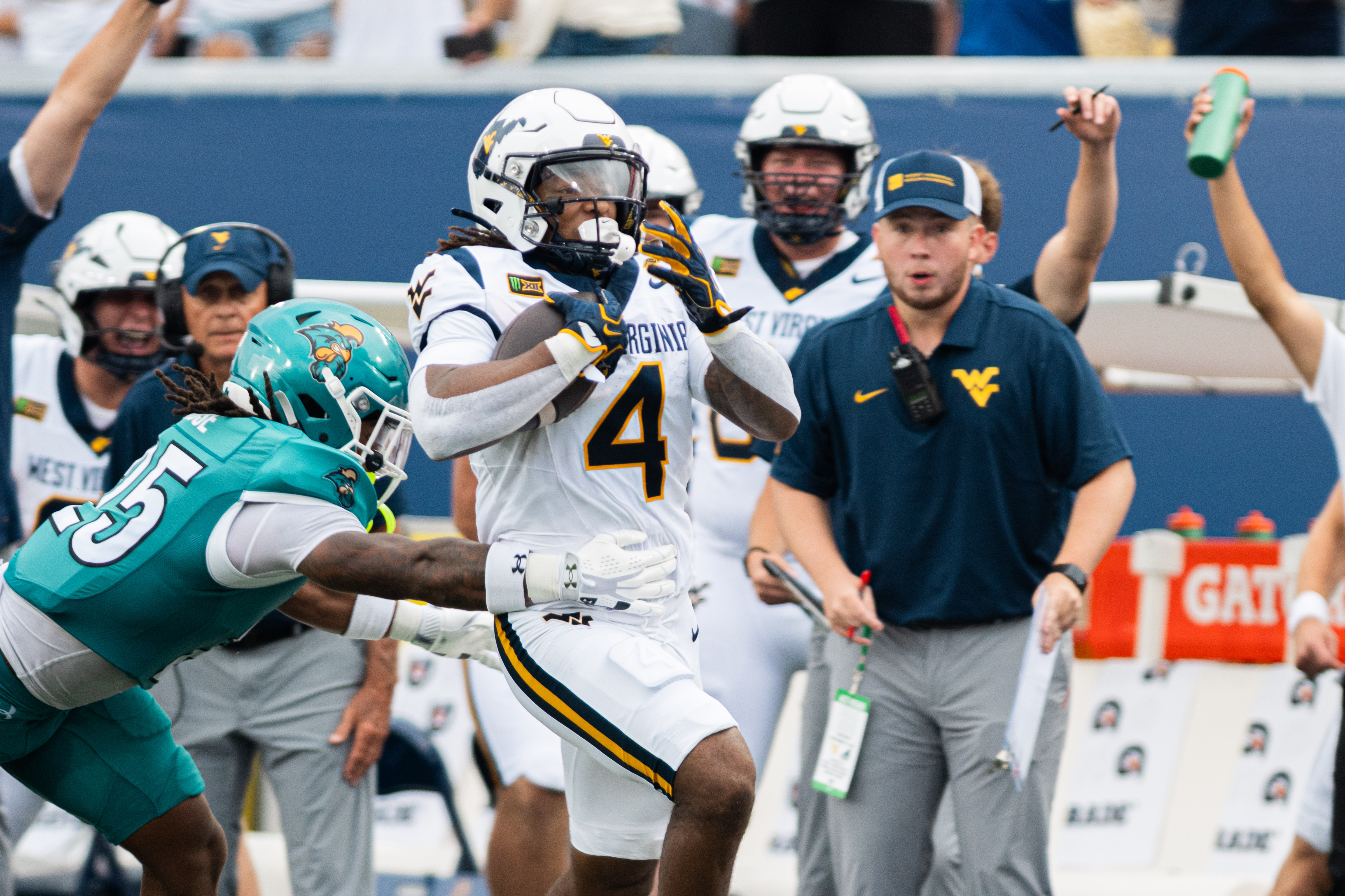 WVU football runs off late Coastal Carolina surge to win first game of season